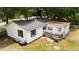 Home's backyard features an elevated deck and a well-manicured lawn at 25824 Shawnee St, Sorrento, FL 32776