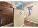 Bathroom featuring tiled shower, toilet, small window, and neutral walls at 25824 Shawnee St, Sorrento, FL 32776
