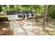 Charming single-story home with a well-maintained front yard and a welcoming entrance, featuring a driveway and manicured landscaping at 25824 Shawnee St, Sorrento, FL 32776