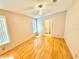 Bright, open bedroom with hardwood floors and an ensuite bathroom at 2585 Karen Dr, Mount Dora, FL 32757