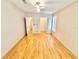 Spacious bedroom with hardwood floors, neutral walls and closet access at 2585 Karen Dr, Mount Dora, FL 32757