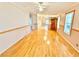 Spacious living area with hardwood flooring and neutral wall colors at 2585 Karen Dr, Mount Dora, FL 32757