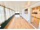 Spacious sunroom with wood floors, bright windows, and lots of natural light at 2585 Karen Dr, Mount Dora, FL 32757