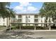 Exterior angle shot showcasing a condo building with covered parking and balconies at 2639 Maitland Crossing Way # 102, Orlando, FL 32810