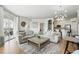 Bright and airy living room with hardwood floors, modern furnishings, and an open layout at 2639 Maitland Crossing Way # 102, Orlando, FL 32810