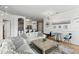 Cozy living room featuring a large sofa, rustic coffee table, and built-in shelving at 2639 Maitland Crossing Way # 102, Orlando, FL 32810
