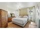 Comfortable bedroom with hardwood floors, natural light, and stylish furnishings at 2639 Maitland Crossing Way # 102, Orlando, FL 32810