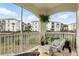 Relaxing screened-in patio overlooking a tranquil waterway and lush landscaping with comfortable seating at 2639 Maitland Crossing Way # 102, Orlando, FL 32810