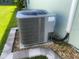 A close up of the home's central air conditioning unit, sitting outside on a bed of gravel at 2648 Maymont Ct, The Villages, FL 32163