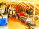 Spacious attic featuring wooden beams and flooring, filled with storage bins and personal items at 2648 Maymont Ct, The Villages, FL 32163