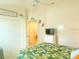 Bedroom featuring a ceiling fan, closet, and a view to the bathroom at 2648 Maymont Ct, The Villages, FL 32163