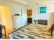 Bright bedroom featuring a nautical theme, view to the kitchen, and neutral decor at 2648 Maymont Ct, The Villages, FL 32163
