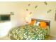 Bright bedroom with fun decorations and an accent wall at 2648 Maymont Ct, The Villages, FL 32163