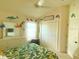 Cheerful bedroom with dolphin theme, decorated with bright pops of color, and inviting textures at 2648 Maymont Ct, The Villages, FL 32163