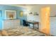 This bedroom has desk area, lots of drawers, and a neutral theme throughout the room at 2648 Maymont Ct, The Villages, FL 32163