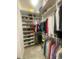 Organized walk-in closet featuring ample shelving and hanging space for clothes and accessories at 2648 Maymont Ct, The Villages, FL 32163