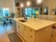 Open concept kitchen island with quartz counters and stainless-steel appliances at 2648 Maymont Ct, The Villages, FL 32163