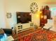 Cozy living room area featuring a large television and stylish rug at 2648 Maymont Ct, The Villages, FL 32163