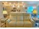 Comfortable living room with view to kitchen and access to the outside at 2648 Maymont Ct, The Villages, FL 32163
