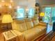 Inviting living room with a comfortable leather sofa and ambient lighting at 2648 Maymont Ct, The Villages, FL 32163