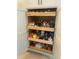 Spacious pantry with lots of adjustable wooden shelves for flexible storage at 2648 Maymont Ct, The Villages, FL 32163