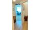 Hallway view into a dedicated 'Personal Cave' with desk, office chair and lots of light at 2648 Maymont Ct, The Villages, FL 32163
