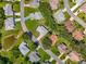 Overhead aerial view showcasing the home's roof, landscaping, and neighborhood layout at 27141 Racquet Cir, Leesburg, FL 34748