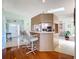 Kitchen featuring a bar with stools, stainless appliances and lots of natural light at 27141 Racquet Cir, Leesburg, FL 34748