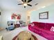 Bright and spacious living room showcasing neutral carpet, comfortable seating, and tasteful decor at 27141 Racquet Cir, Leesburg, FL 34748
