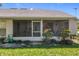 Enclosed screened porch, perfect for relaxing and enjoying the outdoors, with lush greenery surrounding the space at 27141 Racquet Cir, Leesburg, FL 34748