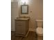 Cozy bath features updated vanity, stylish mirror, granite counters, and modern lighting at 2961 Northland Rd, Mount Dora, FL 32757