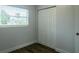 Cozy bedroom featuring a window for natural light and a closet for storage at 2961 Northland Rd, Mount Dora, FL 32757