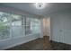 This bedroom is spacious with wood floors and a large window with closet at 2961 Northland Rd, Mount Dora, FL 32757