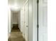 Bright hallway with wood flooring providing access to various rooms in the home at 2961 Northland Rd, Mount Dora, FL 32757