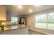 Bright eat-in kitchen features stainless appliances, granite counters, and tile floors at 2961 Northland Rd, Mount Dora, FL 32757