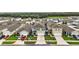 Aerial view of home and neighborhood showing other homes and landscaping in a Gathering-friendly community at 30422 Pintail Dr, Leesburg, FL 34748