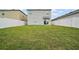 Expansive backyard featuring a lush lawn and white fencing, providing ample space for outdoor activities and relaxation at 30422 Pintail Dr, Leesburg, FL 34748