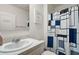 Well-lit bathroom featuring a sink vanity and a stylish shower curtain for a clean and modern look at 30422 Pintail Dr, Leesburg, FL 34748