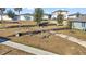 Outdoor exercise area featuring various fitness equipment and seating, surrounded by greenery at 30422 Pintail Dr, Leesburg, FL 34748
