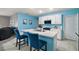 Bright kitchen with white cabinets, breakfast bar, and stainless appliances at 30422 Pintail Dr, Leesburg, FL 34748