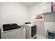 Functional laundry room equipped with modern washer and dryer units, ensuring efficient laundry tasks at 30422 Pintail Dr, Leesburg, FL 34748