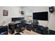 Well-appointed office space with large monitors, a comfortable chair, and ambient lighting at 30422 Pintail Dr, Leesburg, FL 34748