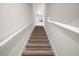 Carpeted staircase leads to the upper level at 30422 Pintail Dr, Leesburg, FL 34748