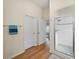 Bright bathroom with walk-in shower, hardwood floors, and open layout at 3057 Saint Thomas Ln, The Villages, FL 32162