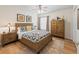 Comfortable bedroom featuring hardwood floors, wood furniture, and natural light at 3057 Saint Thomas Ln, The Villages, FL 32162
