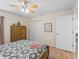 Cozy bedroom with wood accents, hardwood floors, and natural light at 3057 Saint Thomas Ln, The Villages, FL 32162