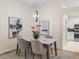 Dining room featuring an open concept floor plan with hardwood floors and updated decor at 3057 Saint Thomas Ln, The Villages, FL 32162