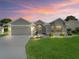 Charming single-story home with a well-manicured lawn and a beautifully landscaped front yard, perfect for curb appeal at 3057 Saint Thomas Ln, The Villages, FL 32162