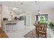 Eat-in kitchen with granite countertops, stainless steel appliances and view of a cozy breakfast nook at 3057 Saint Thomas Ln, The Villages, FL 32162