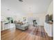 Spacious living room featuring an open floor plan, hardwood floors, and modern decor for comfortable living at 3057 Saint Thomas Ln, The Villages, FL 32162